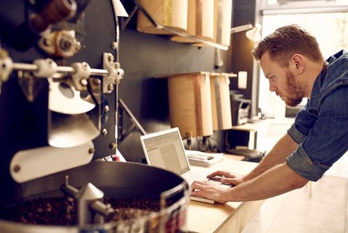 coffee-roaster-checking-emails.jpg